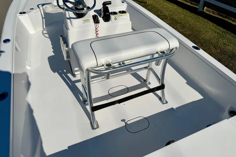 Slide: The Image of 2014 Sportsman Tournament 214 Bay Boat interior with steering console and seating. - 9