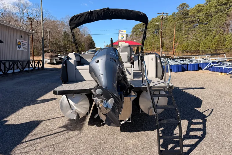 Slide: The Image of 2026 Veranda Relax VR 265 VL pontoon boat with outboard motor in a sunny outdoor setting. - 3