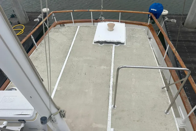 Slide: The Image of 1976 Bristol Trawler deck with wooden railings and dockside view. - 47