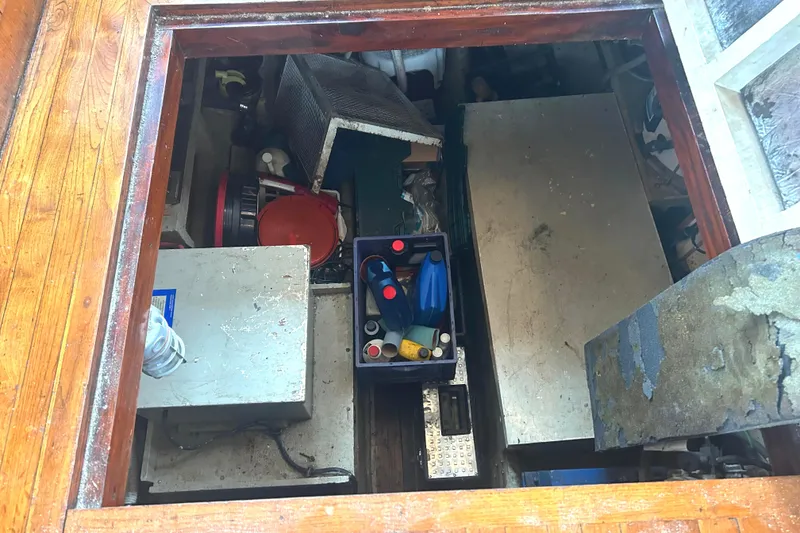 Slide: The Image of Engine room of a 1976 Bristol Trawler with various equipment and storage. - 51