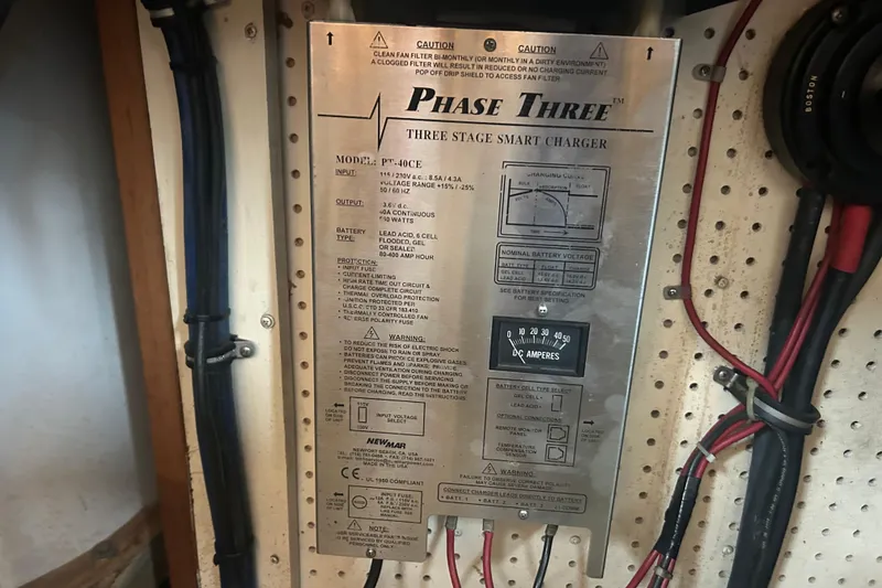 Slide: The Image of 1976 Bristol Trawler's Phase Three smart charger with wiring and specifications. - 57