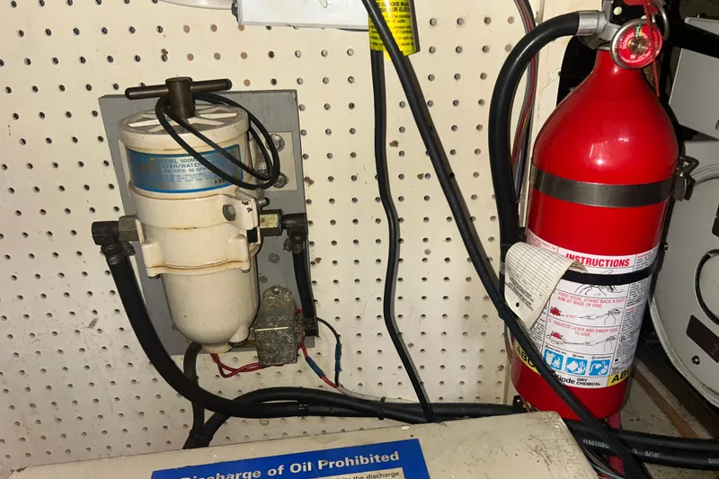 Slide: The Image of Engine room of a 1976 Bristol Trawler with fire extinguisher and fuel filter system. - 59