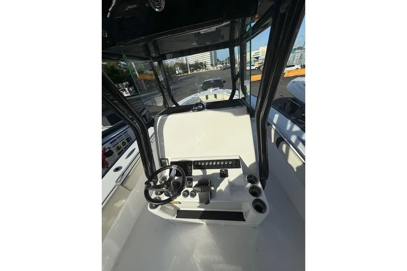 Slide: The Image of 2026 Cape Horn 28XS boat cockpit with steering wheel and controls. - 10