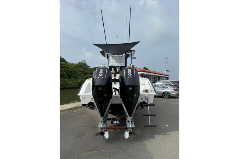 Slide: The Image of 2026 Cape Horn 28XS boat with dual 300 V8 engines at a dockside location. - 13