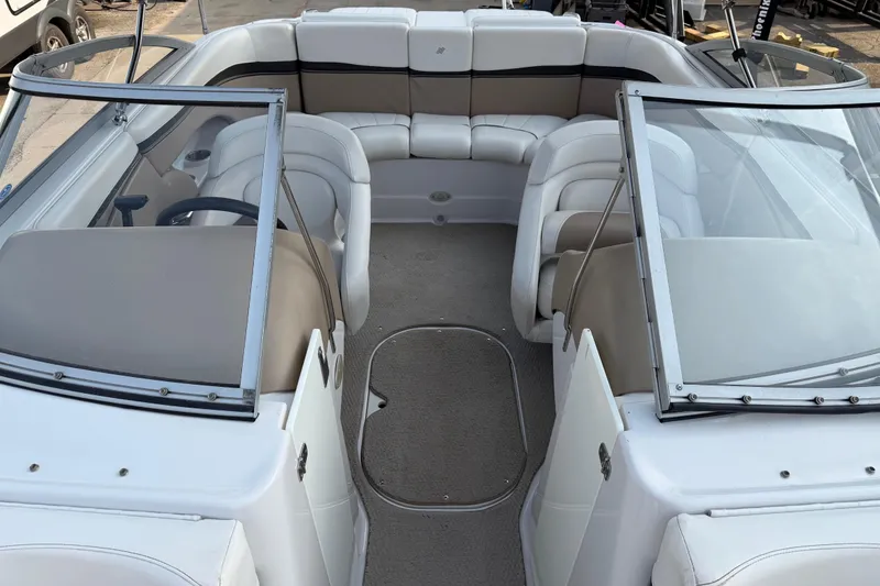 Slide: The Image of 2006 Four Winns 220 Horizon boat interior with beige and white seating. - 7