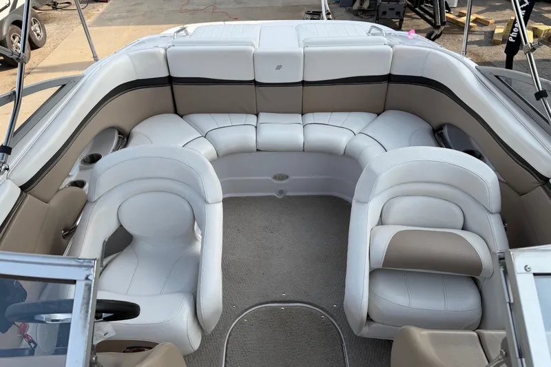 Slide: The Image of 2006 Four Winns 220 Horizon boat interior with white and beige seating. - 8
