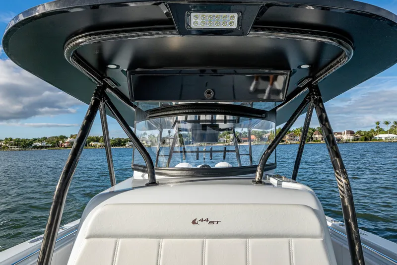 Slide: The Image of 2024 Contender 44 ST boat on water, showcasing sleek design and modern features. - 10