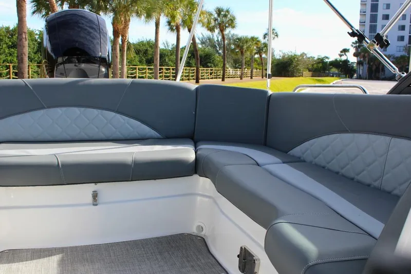 Slide: The Image of 2024 NauticStar 203 DC Deck boat interior with gray cushioned seating. - 19