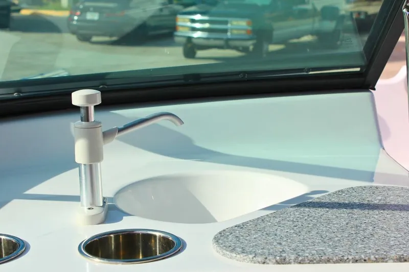 Slide: The Image of 2024 NauticStar 203 DC Deck boat sink and countertop detail. - 23