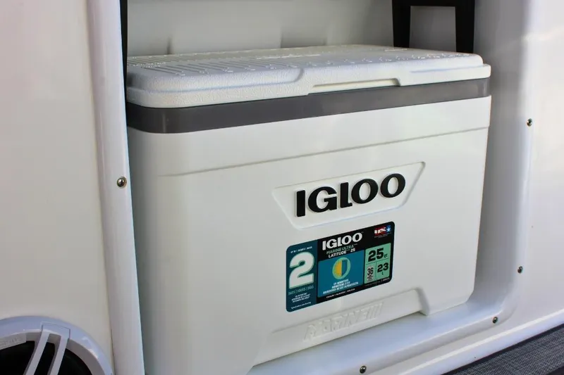 Slide: The Image of Igloo cooler on 2024 NauticStar 203 DC Deck boat, marine storage feature. - 24