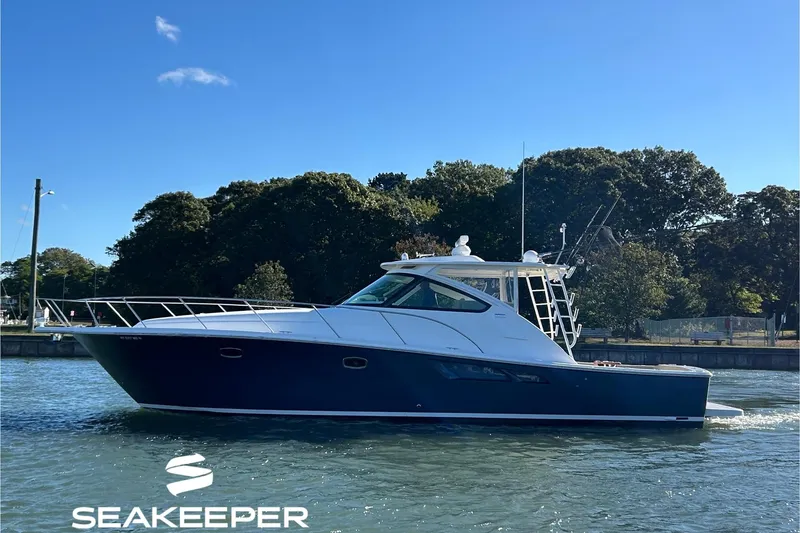 The Image of 2022 Tiara Yachts 43 Open cruising on a sunny day, featuring Seakeeper technology. - 0