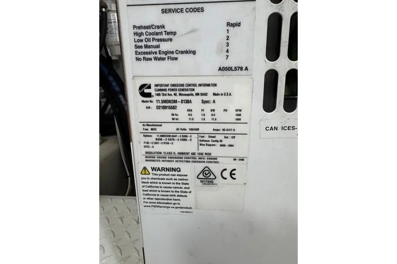 Slide: The Image of Label on Cummins generator in 2022 Tiara Yachts 43 Open, showing service codes and specifications. - 15