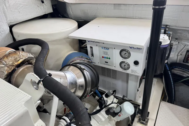 Slide: The Image of Engine room of 2022 Tiara Yachts 43 Open, featuring mechanical equipment and gauges. - 17
