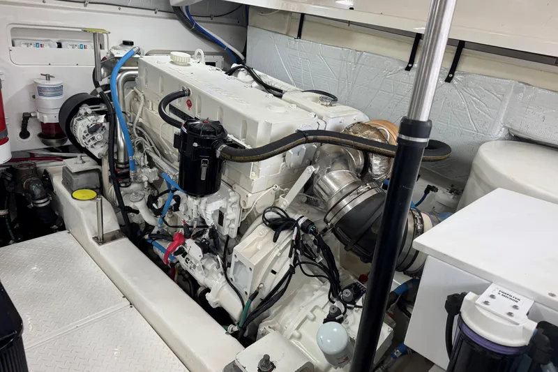 Slide: The Image of Engine room of 2022 Tiara Yachts 43 Open, showcasing clean and organized machinery. - 18
