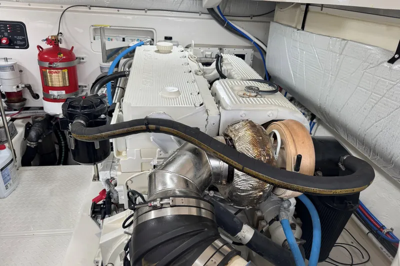Slide: The Image of Engine room of 2022 Tiara Yachts 43 Open, featuring detailed mechanical components. - 19