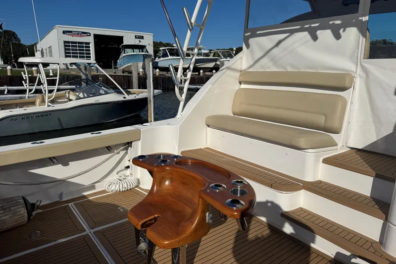 Slide: The Image of 2022 Tiara Yachts 43 Open cockpit with seating and fishing rod holders. - 22
