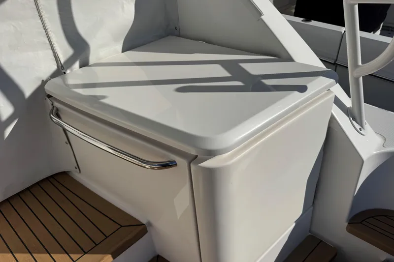 Slide: The Image of 2022 Tiara Yachts 43 Open, sleek white deck detail with stainless steel handle. - 24