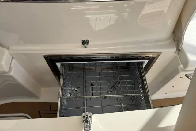 Slide: The Image of Open storage compartment on 2022 Tiara Yachts 43 Open boat. - 29