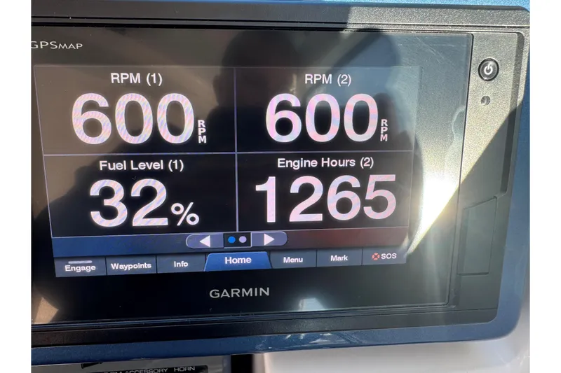 Slide: The Image of Garmin display on 2022 Tiara Yachts 43 Open showing RPM, fuel level, and engine hours. - 33