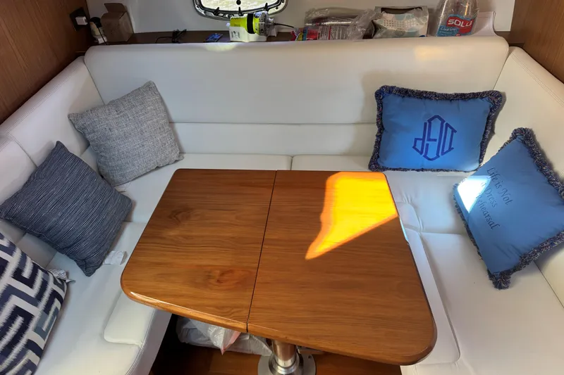 Slide: The Image of Luxurious interior of 2022 Tiara Yachts 43 Open with elegant seating and cushions. - 38