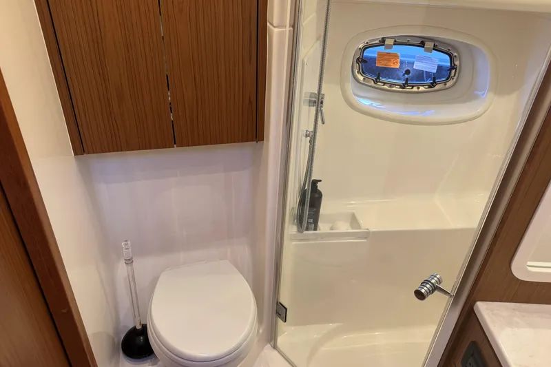 Slide: The Image of Bathroom interior of 2022 Tiara Yachts 43 Open, featuring shower and toilet. - 45