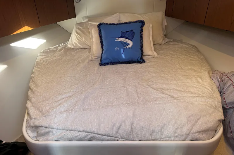 Slide: The Image of Cozy bedroom in 2022 Tiara Yachts 43 Open with nautical-themed decor. - 46