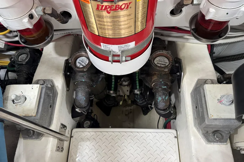 Slide: The Image of Engine compartment of 2022 Tiara Yachts 43 Open with Fireboy fire extinguisher system. - 6