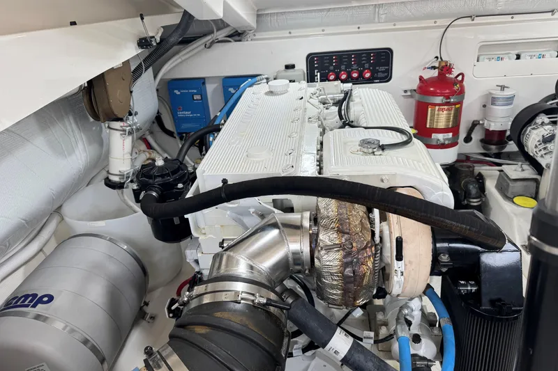 Slide: The Image of Engine room of 2022 Tiara Yachts 43 Open, featuring modern equipment and fire safety system. - 8