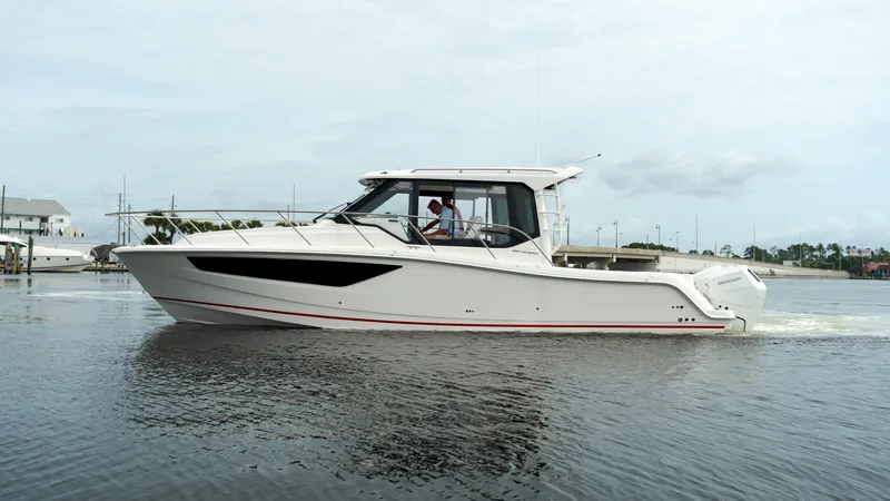Slide: The Image of 2026 Boston Whaler 365 Conquest on calm waters. - 0