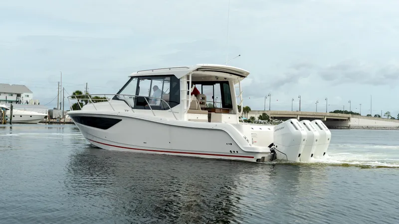Slide: The Image of Boston Whaler 365 Conquest 2026 on calm water, side view. - 1