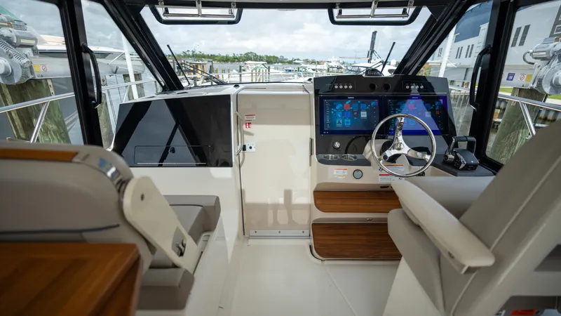 Slide: The Image of Interior of 2026 Boston Whaler 365 Conquest with modern cockpit. - 10