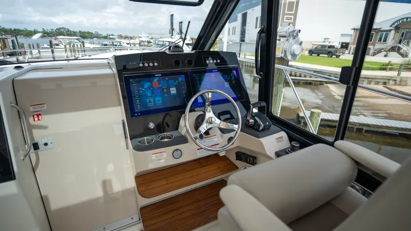 Slide: The Image of Interior view of 2026 Boston Whaler 365 Conquest cockpit with modern controls. - 12