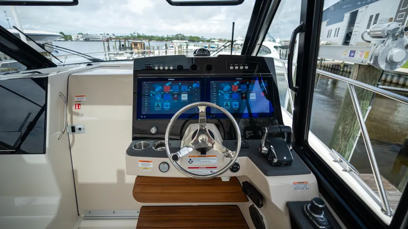 Slide: The Image of 2026 Boston Whaler 365 Conquest cockpit with modern electronics. - 13