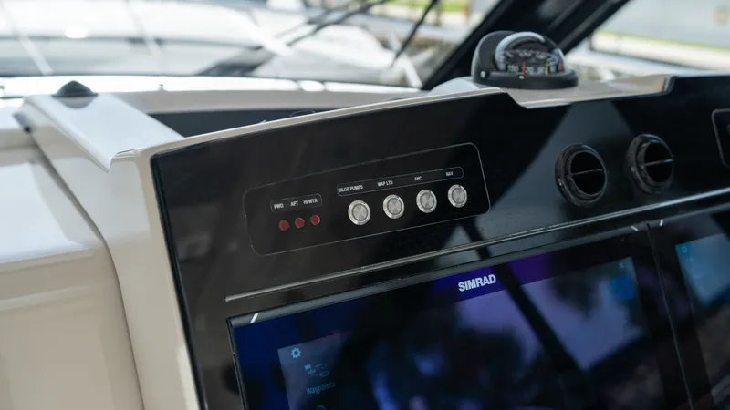 Slide: The Image of Dashboard of 2026 Boston Whaler 365 Conquest with Simrad display. - 14
