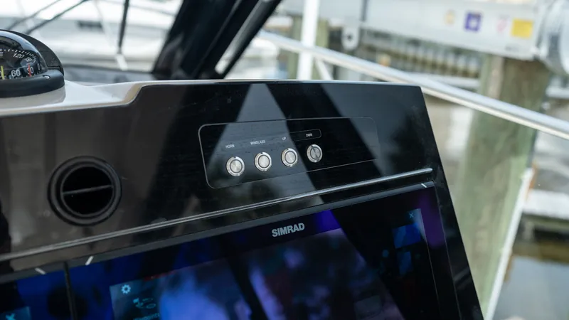 Slide: The Image of Dashboard of 2026 Boston Whaler 365 Conquest with Simrad display. - 15