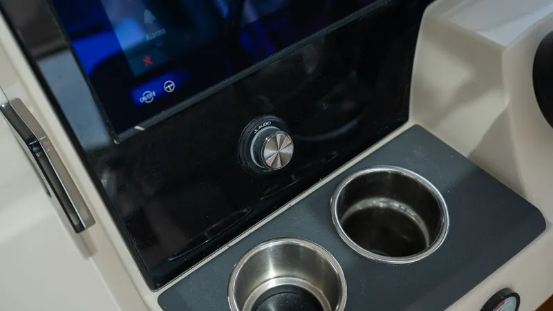 Slide: The Image of Dashboard of 2026 Boston Whaler 365 Conquest with cup holders. - 16