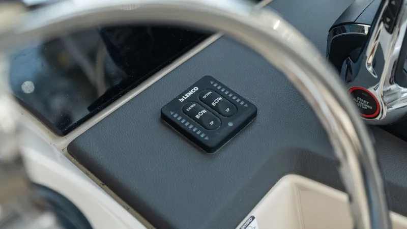 Slide: The Image of Boston Whaler 365 Conquest 2026 helm with Lenco control panel. - 17
