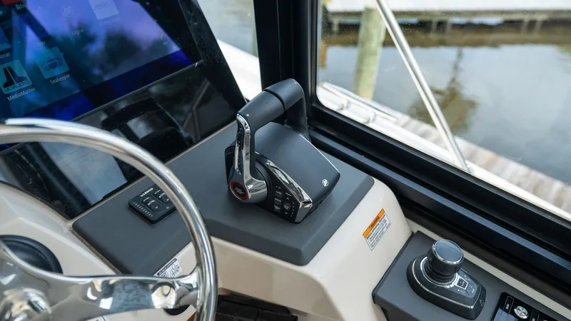 Slide: The Image of Boston Whaler 365 Conquest 2026 helm with advanced controls and technology. - 18