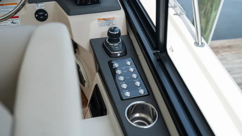Slide: The Image of 2026 Boston Whaler 365 Conquest helm with joystick and control panel. - 19