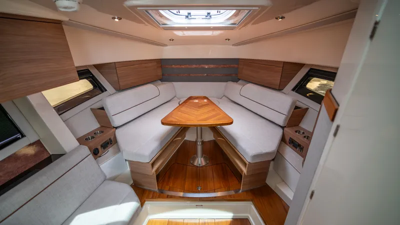 Slide: The Image of Interior of 2026 Boston Whaler 365 Conquest with elegant seating area. - 21