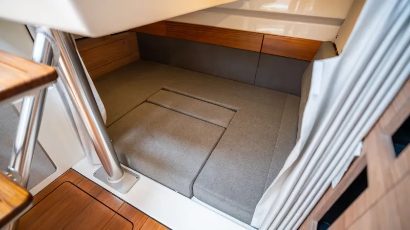 Slide: The Image of Interior of 2026 Boston Whaler 365 Conquest with cozy sleeping area. - 25