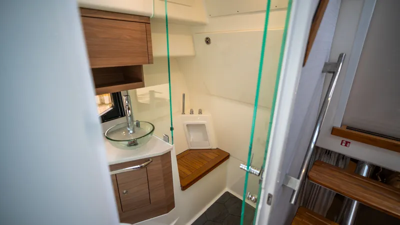Slide: The Image of Interior of 2026 Boston Whaler 365 Conquest featuring modern bathroom design. - 27