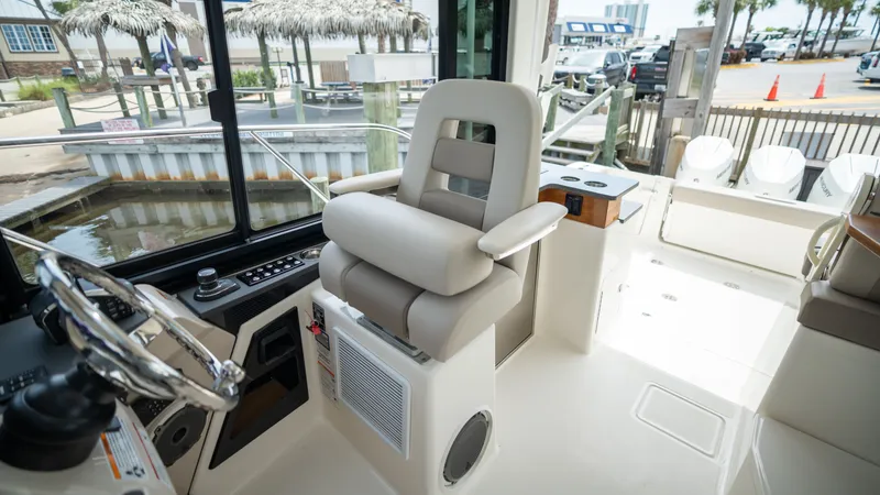 Slide: The Image of Interior of 2026 Boston Whaler 365 Conquest with helm station. - 28