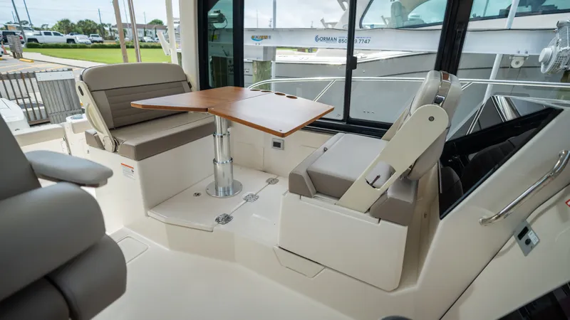 Slide: The Image of Interior of 2026 Boston Whaler 365 Conquest with table and seating. - 30