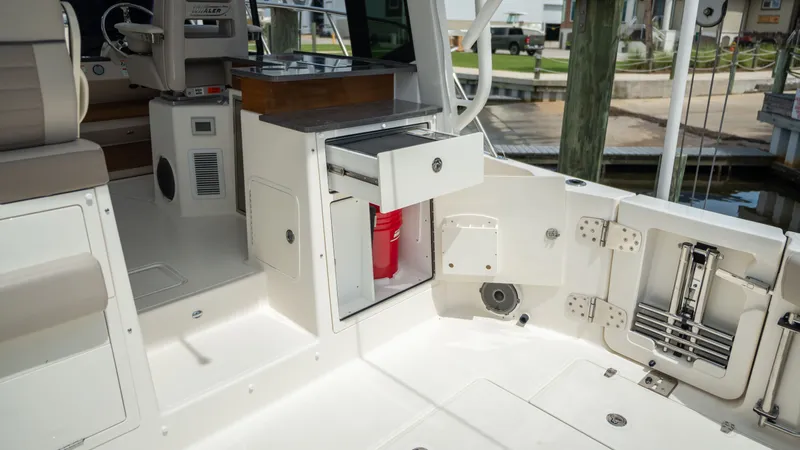 Slide: The Image of Interior of 2026 Boston Whaler 365 Conquest with storage area. - 36