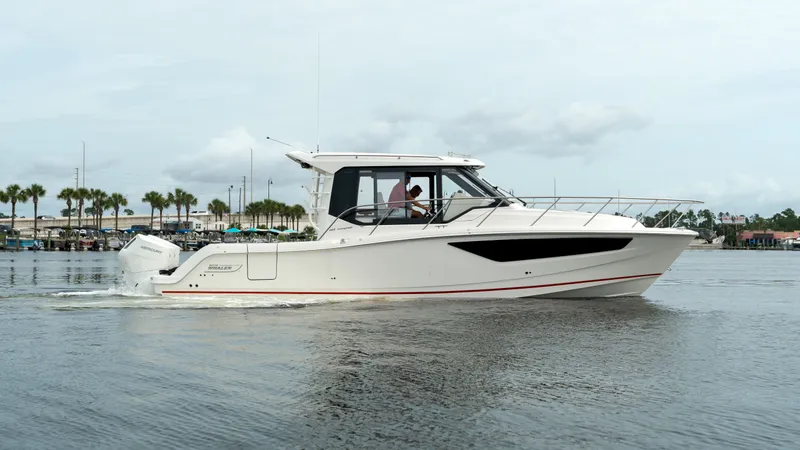 Slide: The Image of 2026 Boston Whaler 365 Conquest on calm waters. - 4