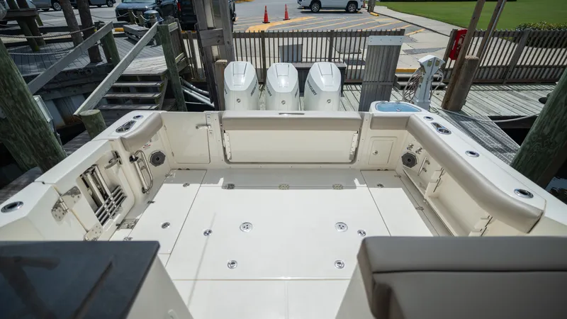 Slide: The Image of Aft deck of 2026 Boston Whaler 365 Conquest with triple outboard engines. - 41