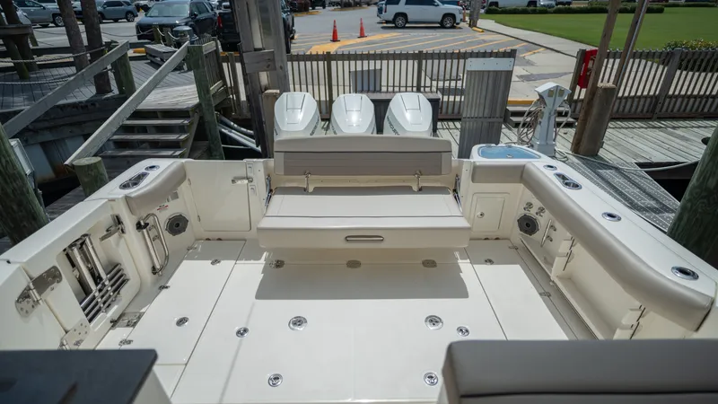 Slide: The Image of Interior of 2026 Boston Whaler 365 Conquest with seating and engines. - 42