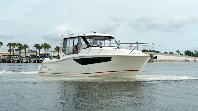 Slide: The Image of 2026 Boston Whaler 365 Conquest on calm waters. - 5