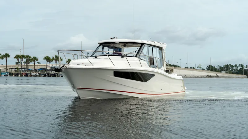 Slide: The Image of Boston Whaler 365 Conquest 2026 on calm waters. - 7